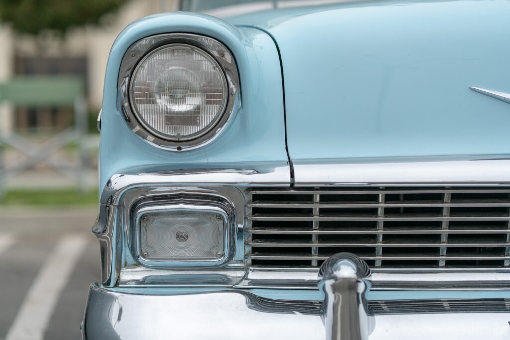 Close up of vintage blue car bumper and lamps